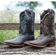 Black and Brown Caiman Belly Print Cowboy Boots in rustic setting